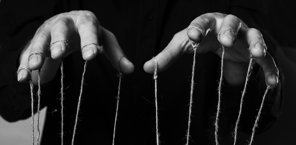 Influence,and,manipulation,concept ,man,hands,with,strings,on,fingers