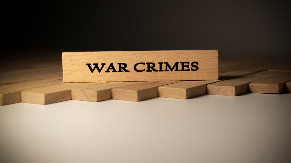 War,crimes,written,on,wooden,surface ,law,and,state