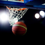 Basketball,going,through,the,hoop,at,a,sports,arena,(intentional