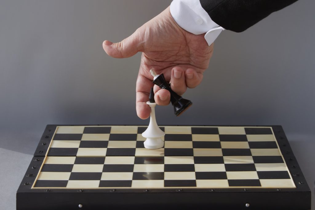 A,hand,places,kings,on,a,chessboard ,change,of,political