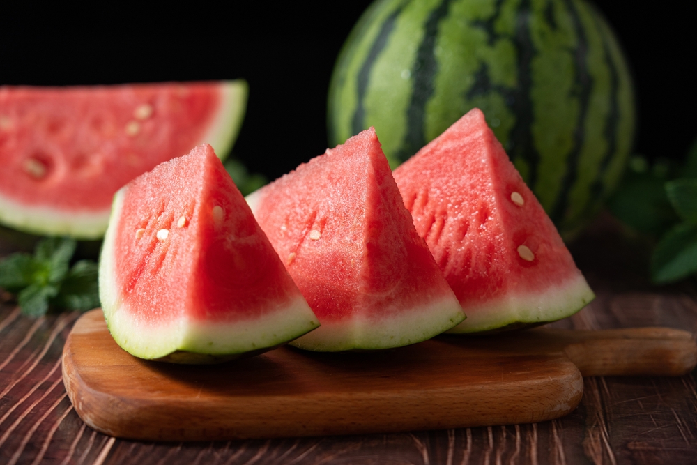 Slices,of,fresh,watermelon,on,the,rustic,wooden,table