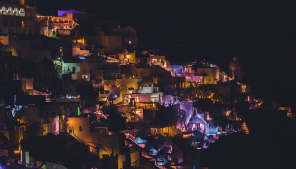 A,colorful,night,city,lights,of,a,houses,in,thira