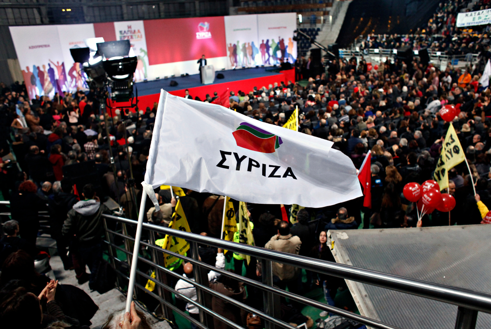 Supporters,of,the,greek,opposition,party,syriza,listening,to,a