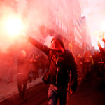 Protesters,of,right wing,and,far right,flemish,associations,light,up,flares