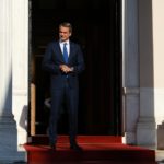 Greece's,prime,minister,kyriakos,mitsotakis,waits,for,a,meeting,at