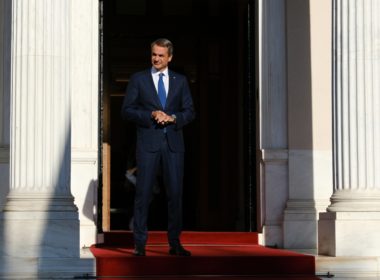 Greece's,prime,minister,kyriakos,mitsotakis,waits,for,a,meeting,at