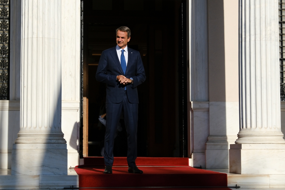 Greece's,prime,minister,kyriakos,mitsotakis,waits,for,a,meeting,at