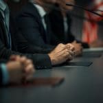 Close,up,on,hands,of,caucasian,male,organization,representative,speaking