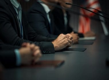 Close,up,on,hands,of,caucasian,male,organization,representative,speaking