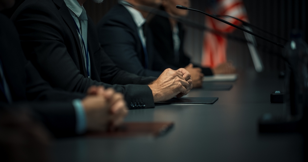 Close,up,on,hands,of,caucasian,male,organization,representative,speaking