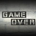 Game,over,stencil,print,on,the,grunge,white,brick,wall