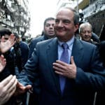 Former,prime,minister,costas,karamanlis,greets,supporters,outside,offices,of