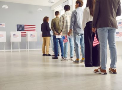 Group,of,american,citizens,people,standing,in,polling,station,with