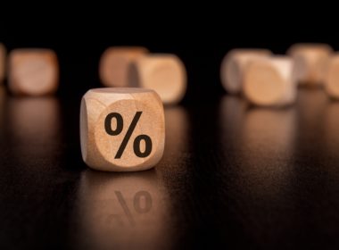 Wooden,dice,with,a,percentage,symbol,,representing,themes,related,to