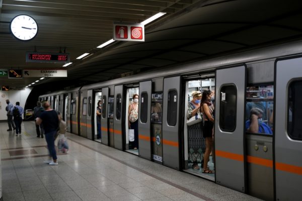 People,wait,on,a,metro,platform,in,athens,,greece,on