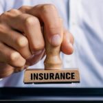 Hand,holding,a,rubber,stamp,that,says,insurance