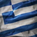 Colourful,waving,flag,of,greece,on,the,old,army,khaki