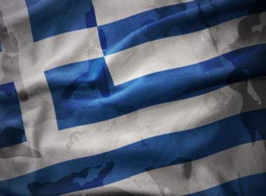 Colourful,waving,flag,of,greece,on,the,old,army,khaki