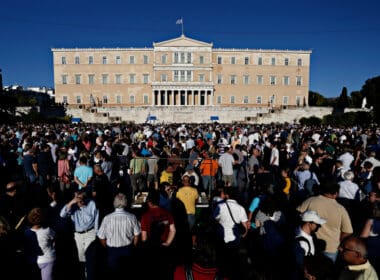 People,chant,slogans,in,front,of,the,greek,parliament,in