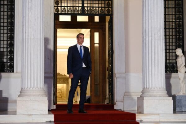 Greece's,prime,minister,kyriakos,mitsotakis,waits,for,a,meeting,at