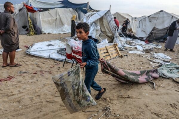 Displaced,palestinians,inspect,their,tents,after,they,were,hit,by
