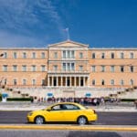 Greece,,athens,,syntagma:,yello,taxi,in,front,of,famous,greek