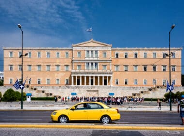 Greece,,athens,,syntagma:,yello,taxi,in,front,of,famous,greek