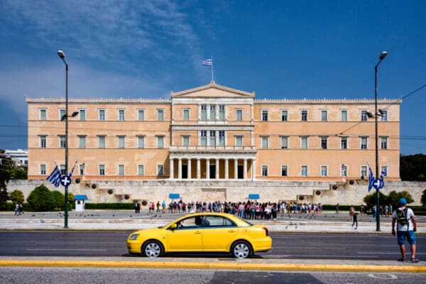 Greece,,athens,,syntagma:,yello,taxi,in,front,of,famous,greek