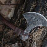 Viking,axe,at,the,forest,background