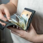 Child,holding,wallet,,takes,out,euro,,theft,money,,managing,pocket