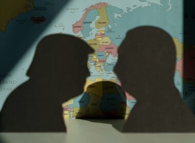 Donald,trump,and,vladimir,putin,silhouettes,over,world,political,map