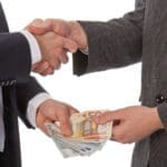 Two,businessmen,and,paying,money;,isolated,on,white