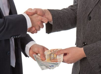 Two,businessmen,and,paying,money;,isolated,on,white