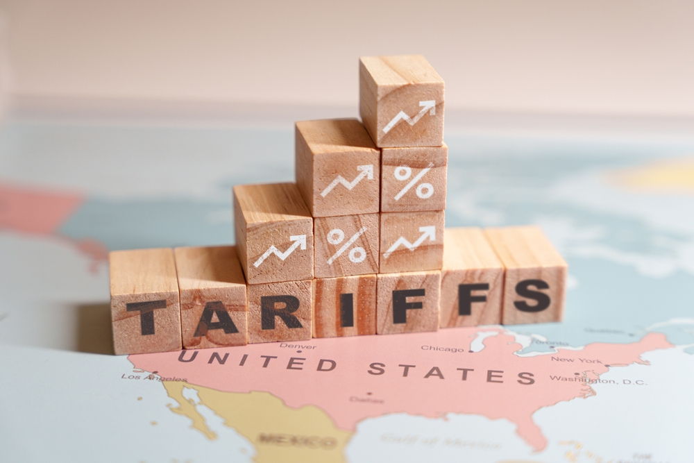 Wooden,blocks,spelling,tariffs,are,placed,on,a,map,of