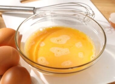 Whisking,eggs ,whipped,raw,eggs,in,a,bowl,with,whisk