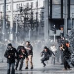 Athens,,greece,,february,28,,2025:,a,photojournalist,falls,to,the