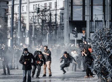 Athens,,greece,,february,28,,2025:,a,photojournalist,falls,to,the