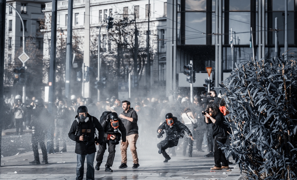 Athens,,greece,,february,28,,2025:,a,photojournalist,falls,to,the