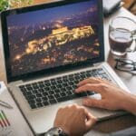 Travel,to,greece,concept ,man,planning,vacations,,sitting,in,his