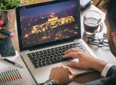 Travel,to,greece,concept ,man,planning,vacations,,sitting,in,his