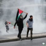 Riot,police,use,pepper,spray,and,a,water,cannon,against