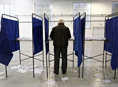 A,man,casts,her,vote,for,the,elections,for,the