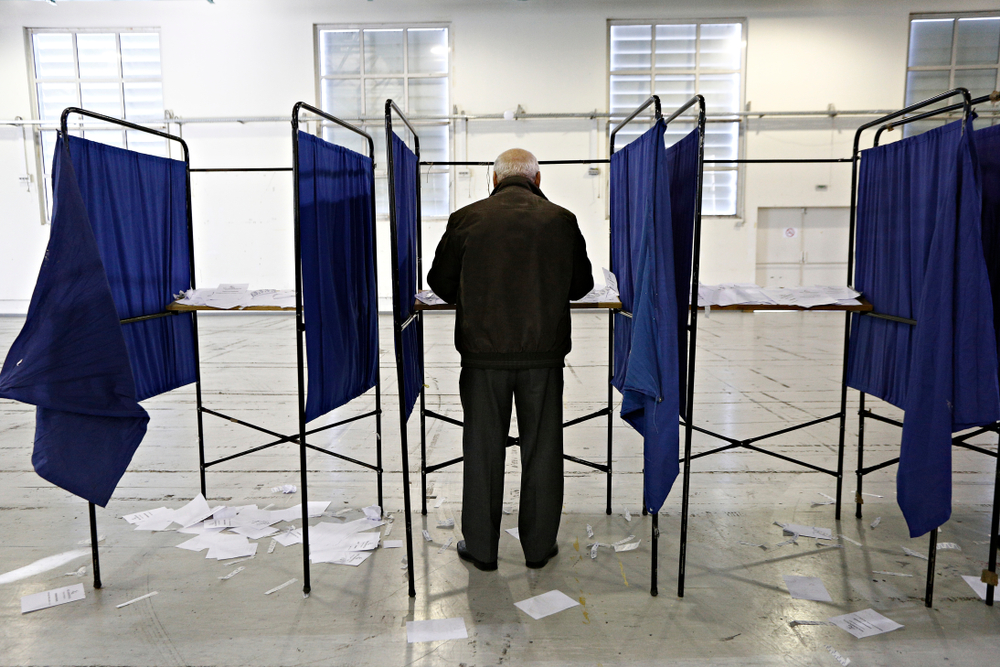 A,man,casts,her,vote,for,the,elections,for,the