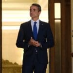 Greece's,prime,minister,kyriakos,mitsotakis,waits,for,a,meeting,at