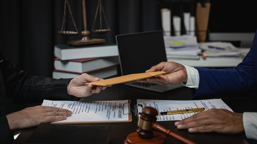 Lawyers,accept,bribes,from,clients,and,competitors,in,corruption,scandals,