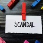 Scandal,writting,on,table,background