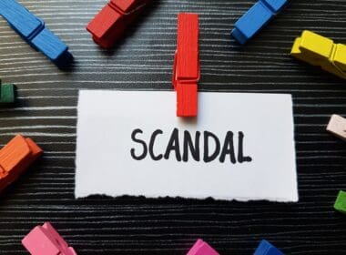 Scandal,writting,on,table,background