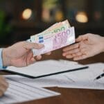 Euro,banknotes,money,on,hand ,concept,of,personal,loan,,home