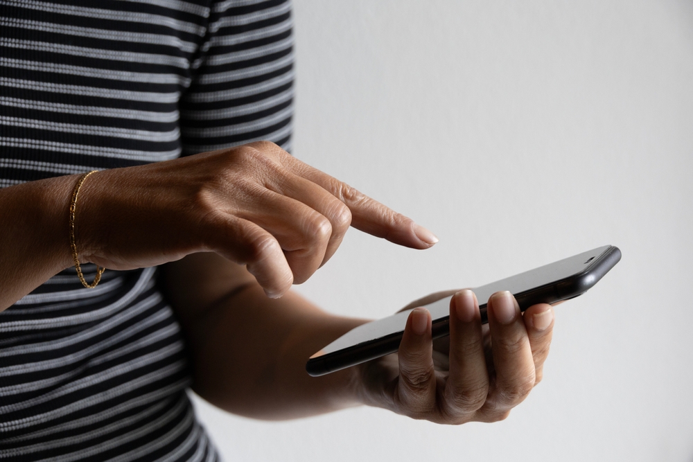 Woman,using,a,smartphone,business,communication,,secure,internet,banking,intuitive