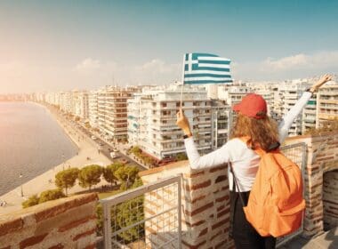 Happy,student,traveller,girl,with,a,greek,flag,on,the
